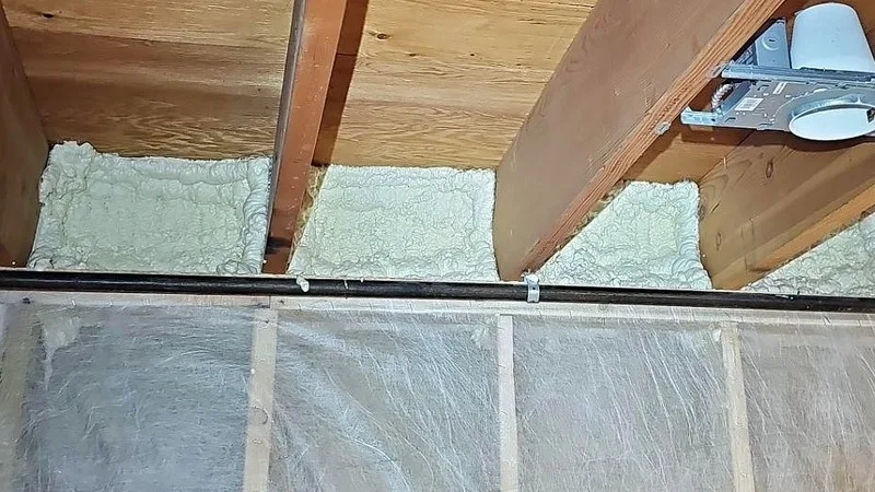 Rim joist cavities sealed with spray foam between the floor joist ends